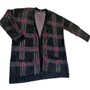Cozy eyelash knit cardigan with front pockets.  Slightly oversized.